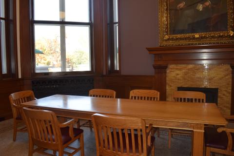 Lucy Hammer Room, small conference room with rectangular table and eight chairs, with room for an addition four to six on the perimeter